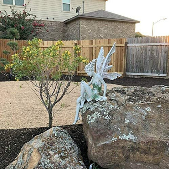 Avtoit | Statue of sitting fairy in the garden