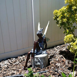 Avtoit | Statue of sitting fairy in the garden