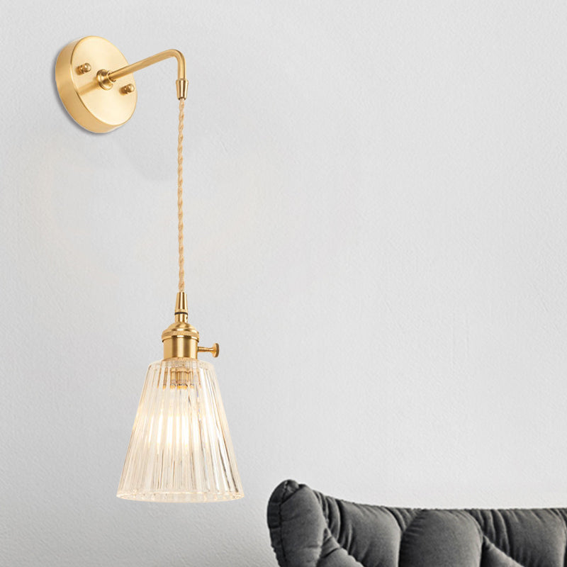Avtoit | A wall light with a bulb and conical shade made of clear, textured glass, industrial bedroom wall light fixture