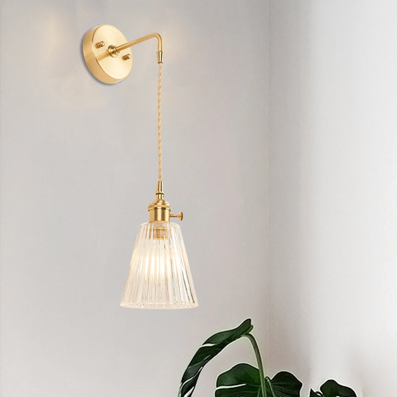 Avtoit | A wall light with a bulb and conical shade made of clear, textured glass, industrial bedroom wall light fixture
