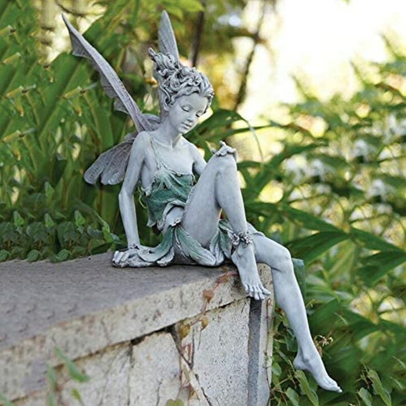Avtoit | Statue of sitting fairy in the garden