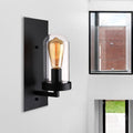 Avtoit | A wall lamp with a capsule shade made of clear glass, industrial living room wall lighting in black