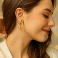 Avtoit | Elegant Gold Colored Twisted Hoop Earrings with Mesh Pattern