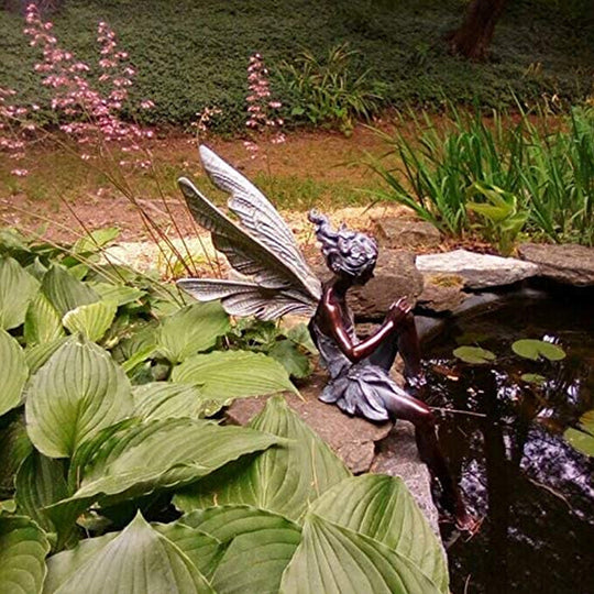 Avtoit | Statue of sitting fairy in the garden