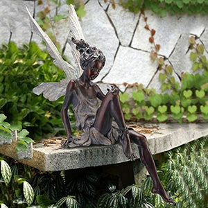 Avtoit | Statue of sitting fairy in the garden