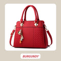 Avtoit | Elegant women's bag with tassel pendant