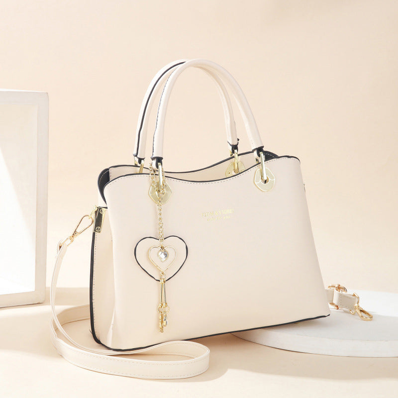 Avtoit | Elegant women's handbag with sparkling heart pendant
